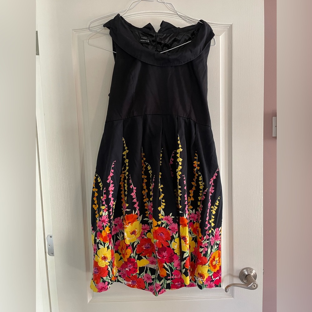 Black dress with multicolored flowers.